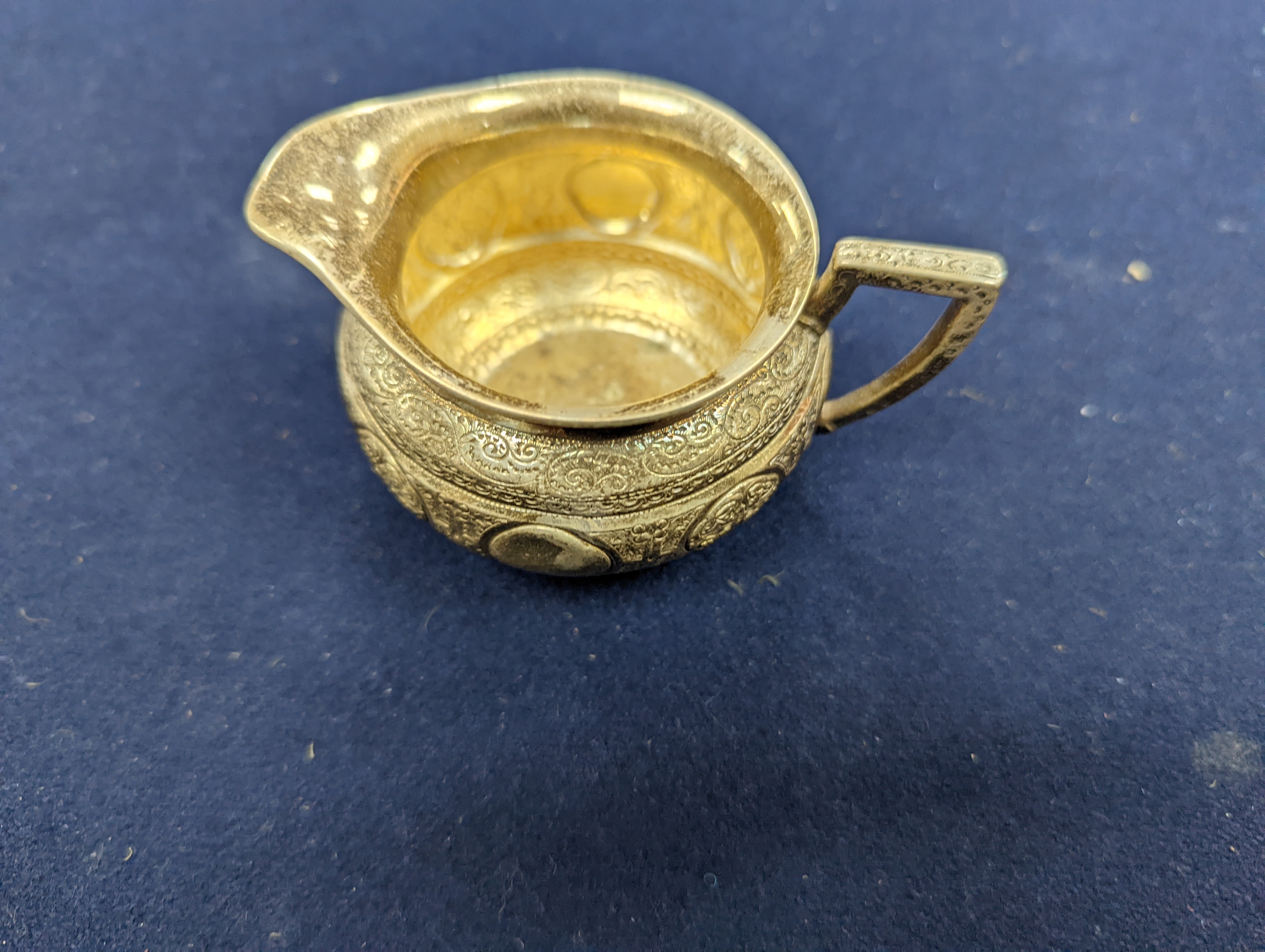 A WMF dish, Islamic white metal mounted photo album and a plated teapot and jug